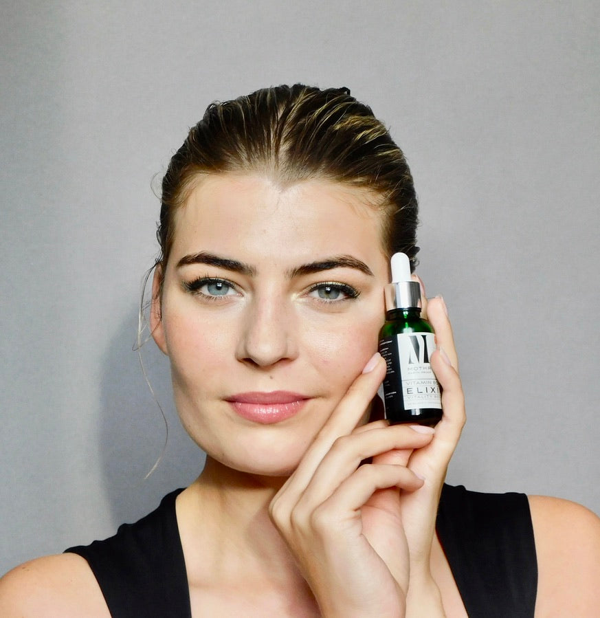 How to repair your sun damaged skin cells - model with blue eyes and hoody