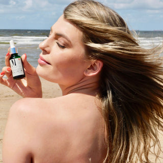 natural vitamin A - foto with step 3 afce oil elixir and model long hair at beach