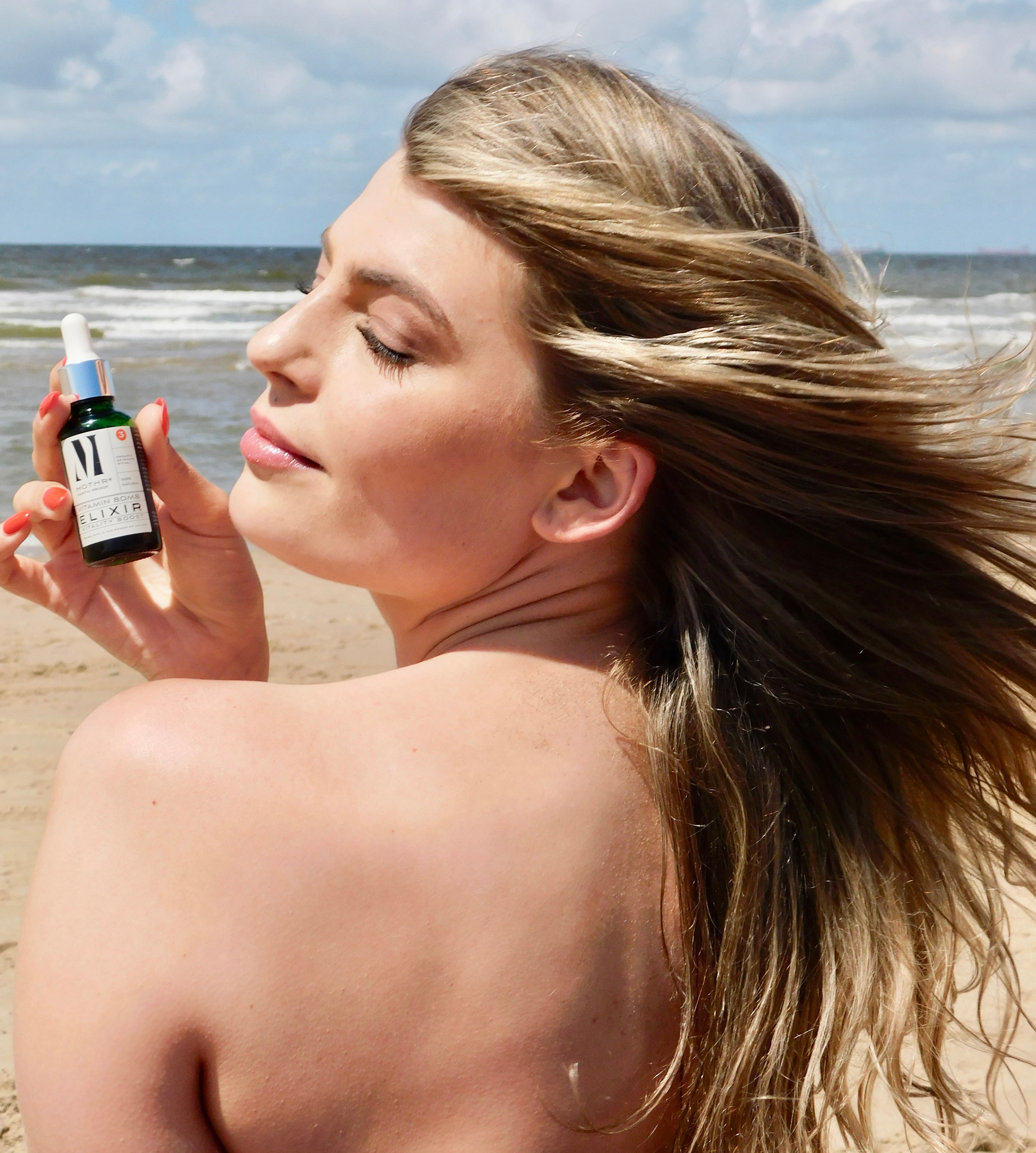 natural vitamin A - foto with step 3 afce oil elixir and model long hair at beach